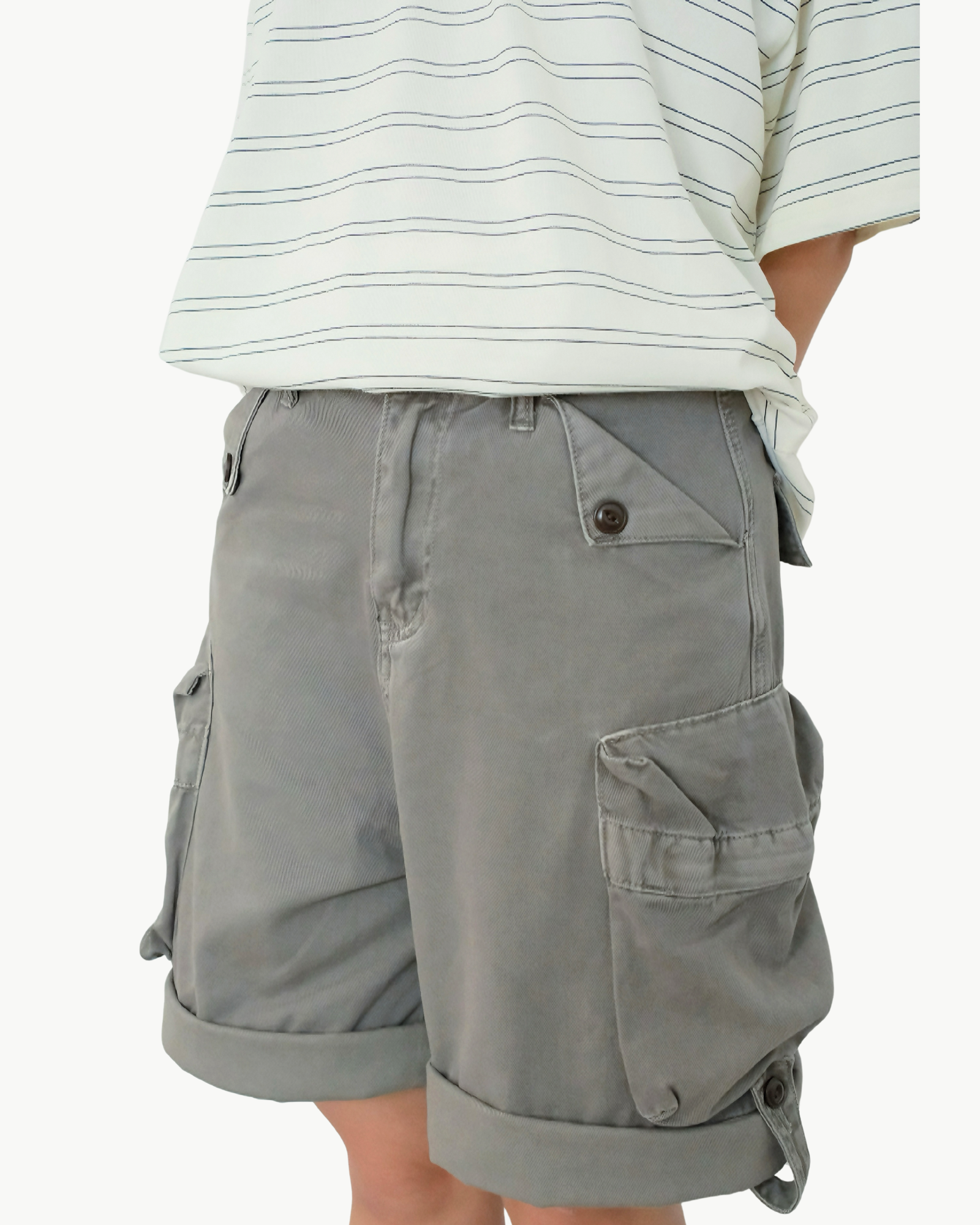Gray cargo shorts worn by a person on a white background